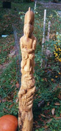 Thinker totem pole in garden